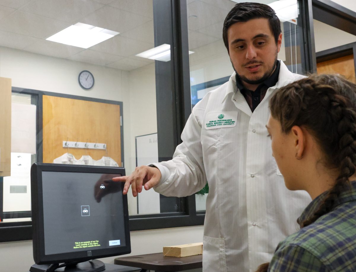 Stefan Delmas explains the useful field of view test to Elinor Stutler in the Movement Neuroscience Rehabilitation Lab at Colorado State University Sept. 19. "This tests individuals' ability to pay attention to two things at once," Delmas said. "It’s highly robust and validated as a way to assess crash risk."