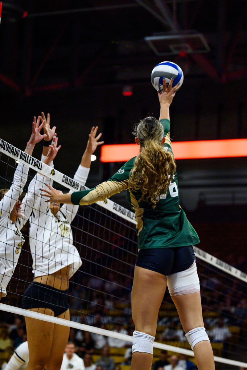 Outside hitter Maria Brun (26) taps the ball over the net during Colorado State University's game against the University of Colorado in the CU Events Center Sept. 19. CSU won 3-1.