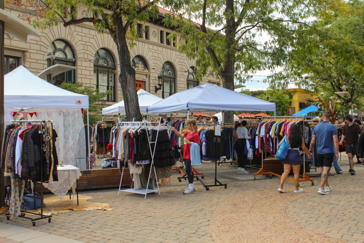 Shoppers browse the Saturday Vintage Market in Oak Street Plaza in Old Town Sept. 20. 