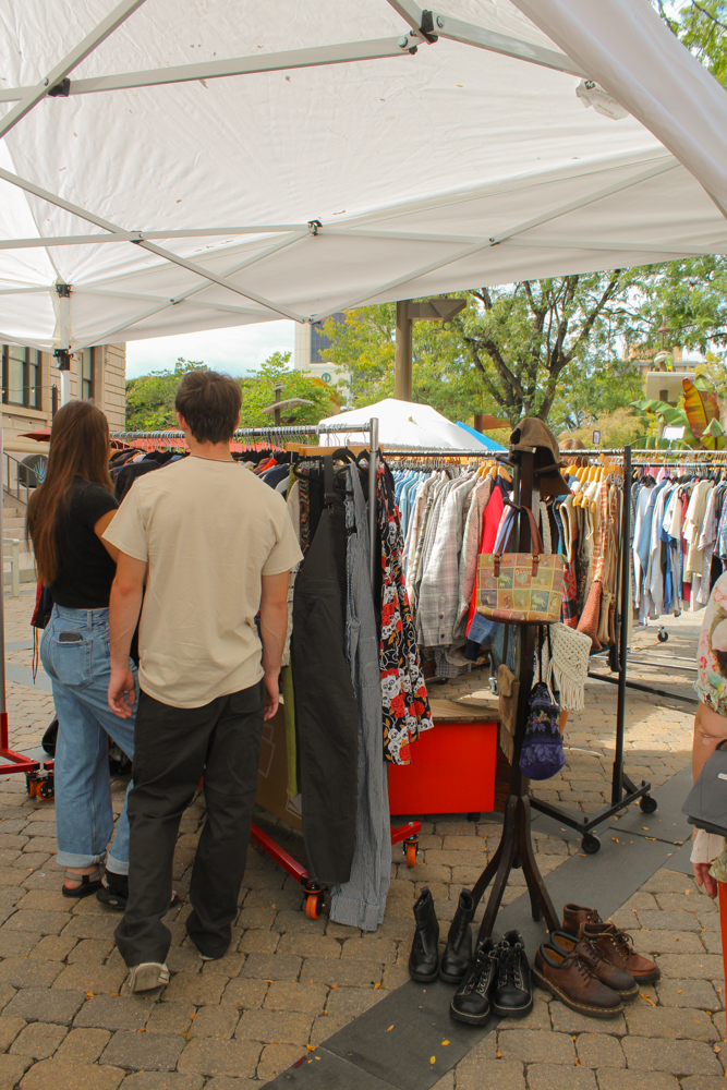 Shoppers sift through the collections of clothes in the open air vintage market Sept. 20.