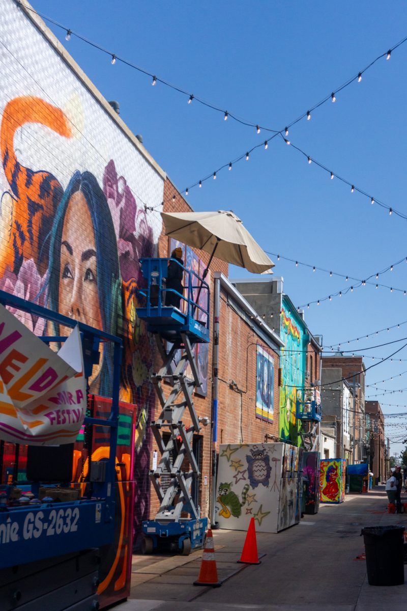 Artists work on their murals during WeldWalls Mural Festival in Greeley Sept 20. Weld Walls brings together artists to create publicly accessible murals, according to the website. The event includes artist talks, workshops, mural unveilings, and a community celebration.
