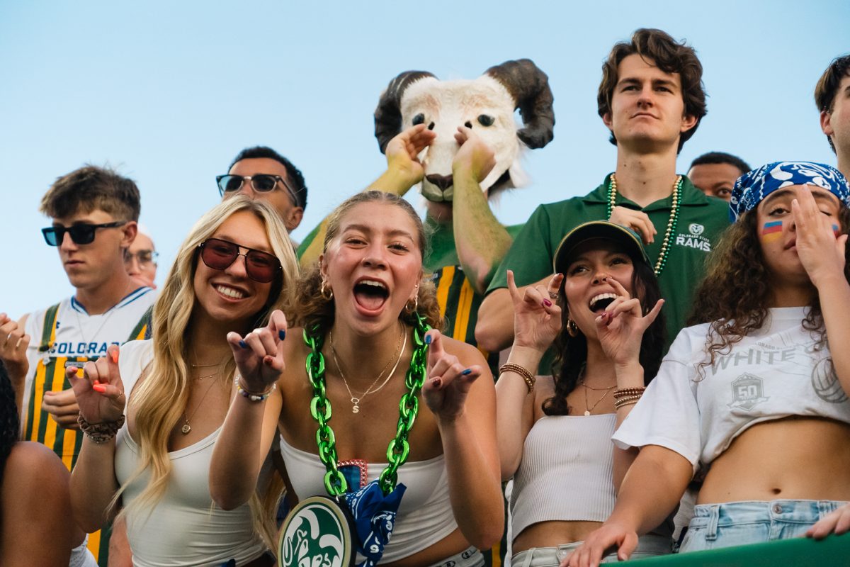 Colorado State University students cheer in the student section during the football game against Washington State University Sept. 27. The Rams wore their white uniforms featuring the Colorado state flag for the State Pride game, and Ram fans wore white to match the theme.