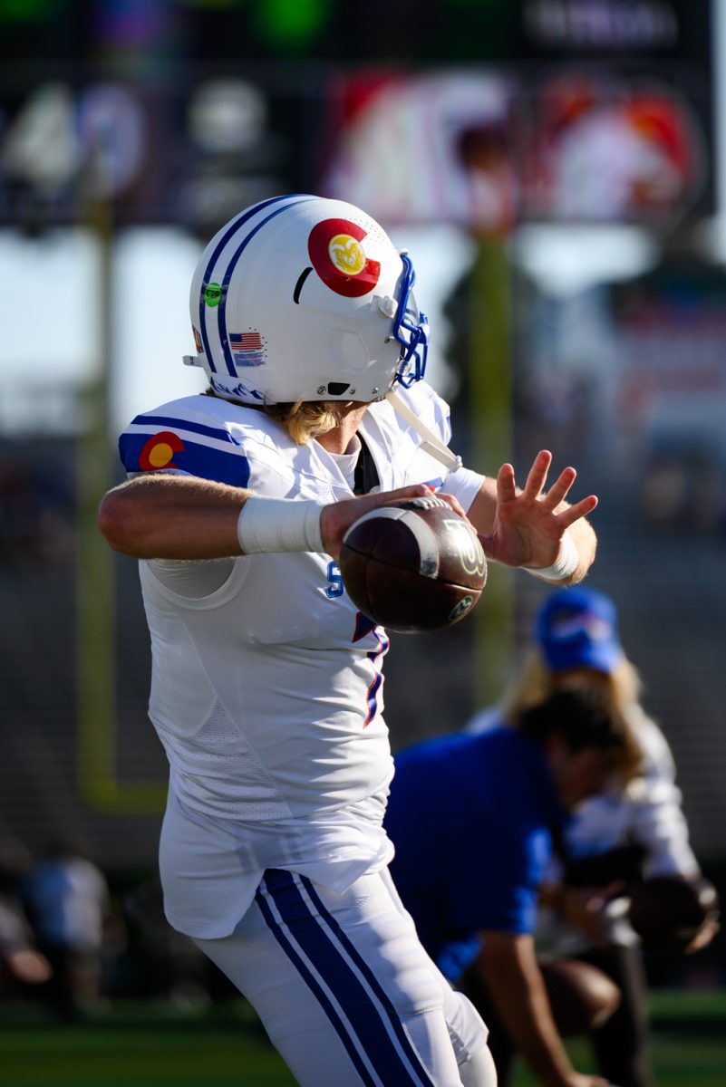 Colorado State University quarterback Jackson Brousseau (7) throws the ball during warmups before CSU's game against Washington State University Sept. 27.