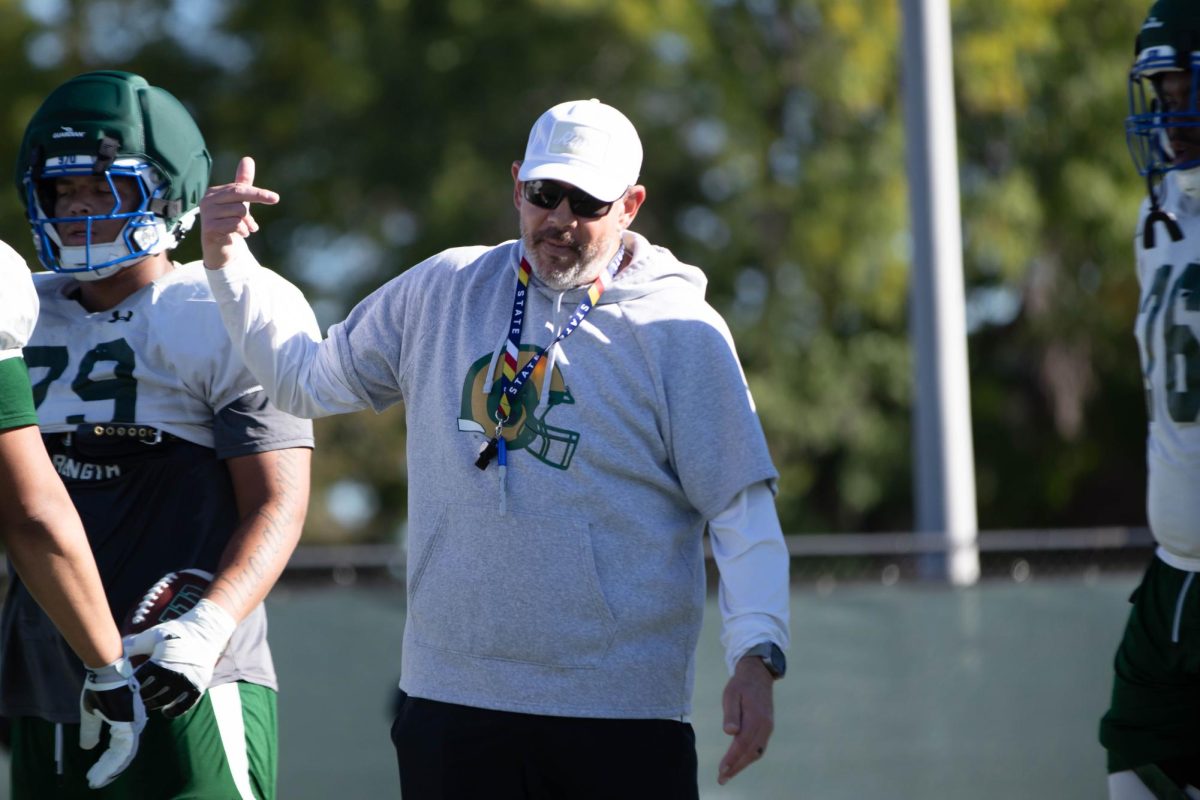 Offensive line coach Bill Best, guides players through techniques during Tuesday morning practice of Sept. 30th at Colorado State University in Fort Collins Colorado. Photo taken by Erica Pickering.