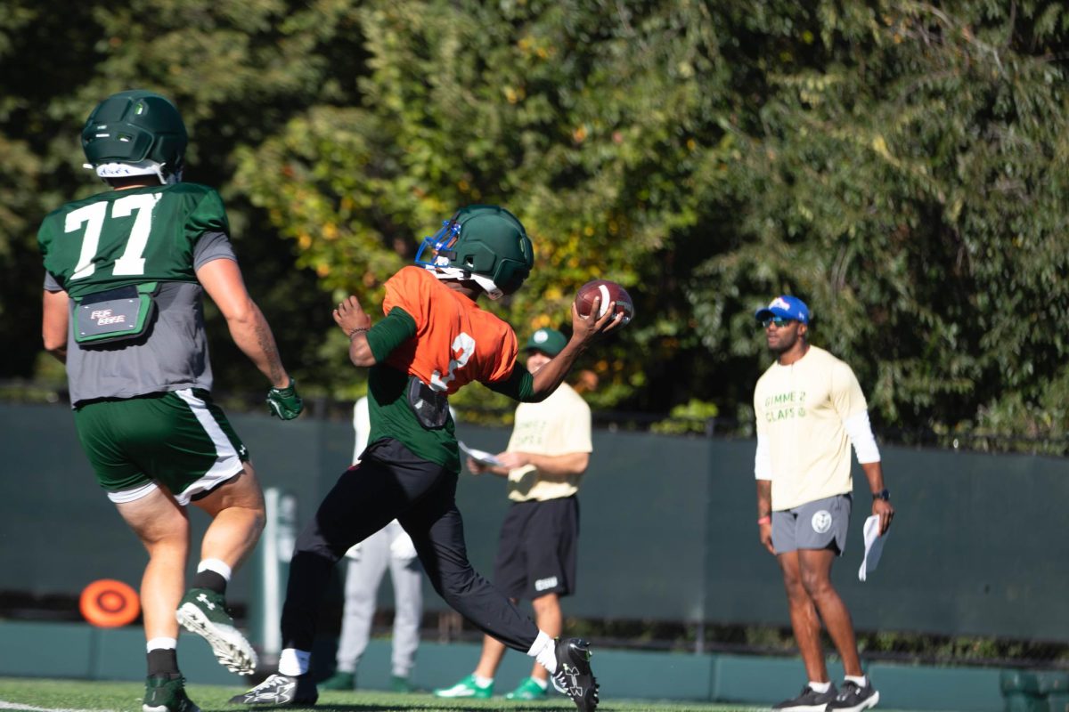 Quarterback Darius Curry prepares to throw the ball during morning practice at Colorado State University on Tuesday Sept. 30th. Photo taken by Erica Pickering.