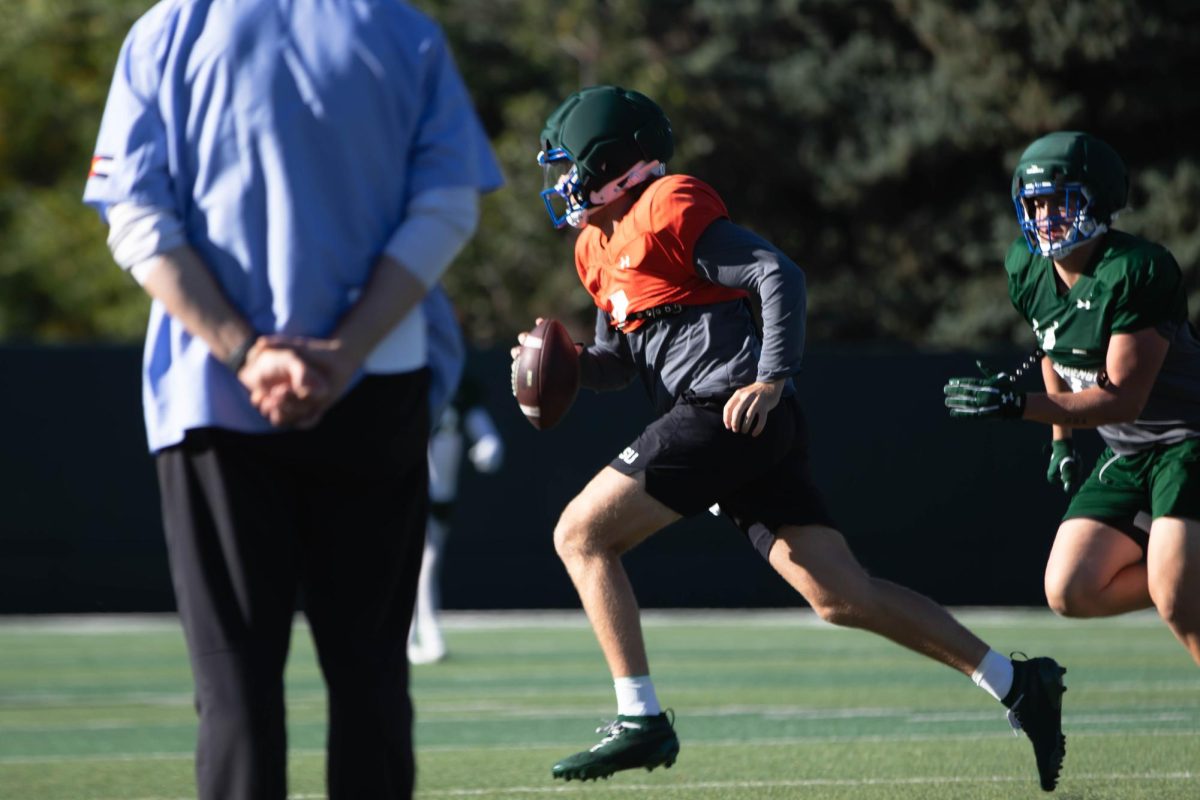 Jackson Brousseau, quarterback, runs the ball during Tuesday morning practice on Sept. 30th at Colorado State University in Fort Collins Colorado. Photo taken by Erica Pickering.