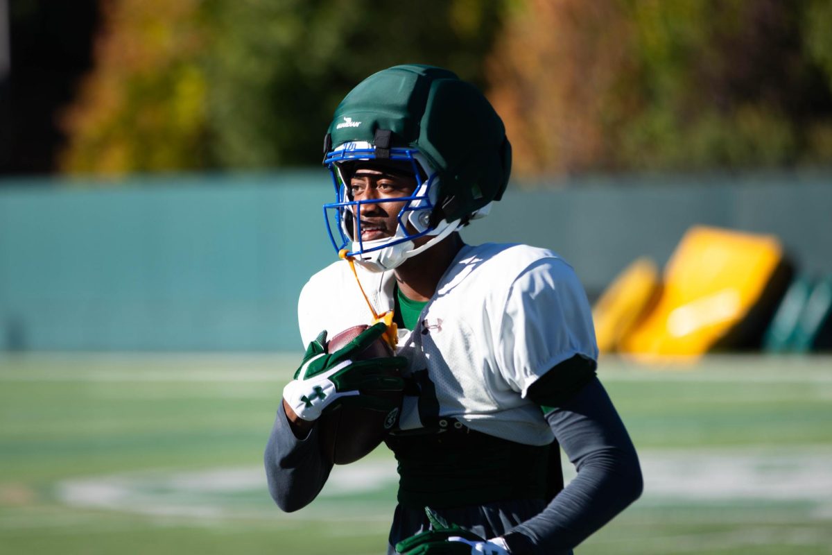 Wide Reciever, Jordan Ross carries the ball toward the sideline during morning practice on Tuesday Sept. 30th  at Colorado State University in Fort Collins Colorado. Photo taken by Erica Pickering.