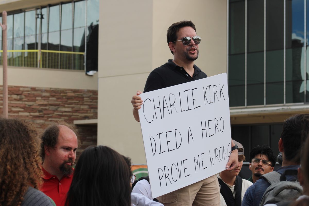 A man named Alex, who declined to provide a last name, sparks debate on the Lory Student Center Plaza by holding a sign debate that reads "Charlie Kirk Died a Hero Prove Me Wrong" the day after conservative activist Charlie Kirk was fatally shot at Utah Valley University Sept. 11.