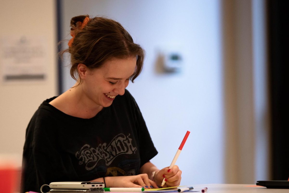 Colorado State University student laughs with others while writing thank you notes to the CSU housing and dining staff on Wednesday Sept. 24th in Fort Collins Colorado. "Our dining staff is not talked about as muh as many other of our areas on campus and I wanted them to be included just as much as everyone else." Said group leader Alasdair Detschman. Photo taken by Erica Pickering