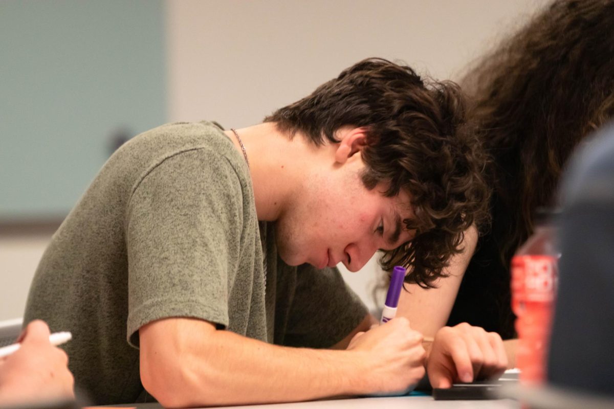 Student at Colorado State University writes down an appreciation note to the CSU housing and dining staff on Wednesday Sept. 24th in Fort Collins Colorado. "Our dining staff is not talked about as muh as many other of our areas on campus and I wanted them to be included just as much as everyone else." Said group leader Alasdair Detschman. Photo taken by Erica Pickering.