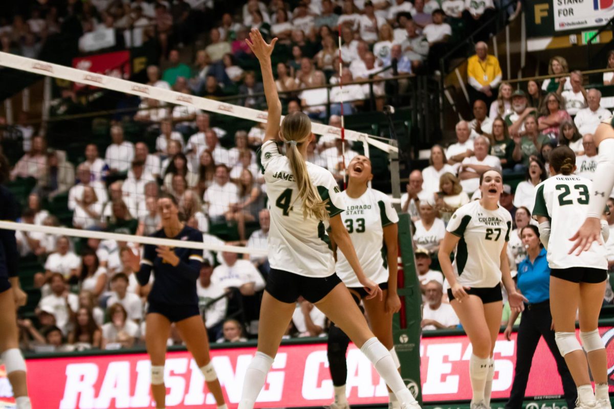 Colorado State University volleyball players celebrate a winning play during game against Notre Dame in MOby arena in Fort Collins Colorado on Sept. 12th. Photo taken by Erica Pickering.