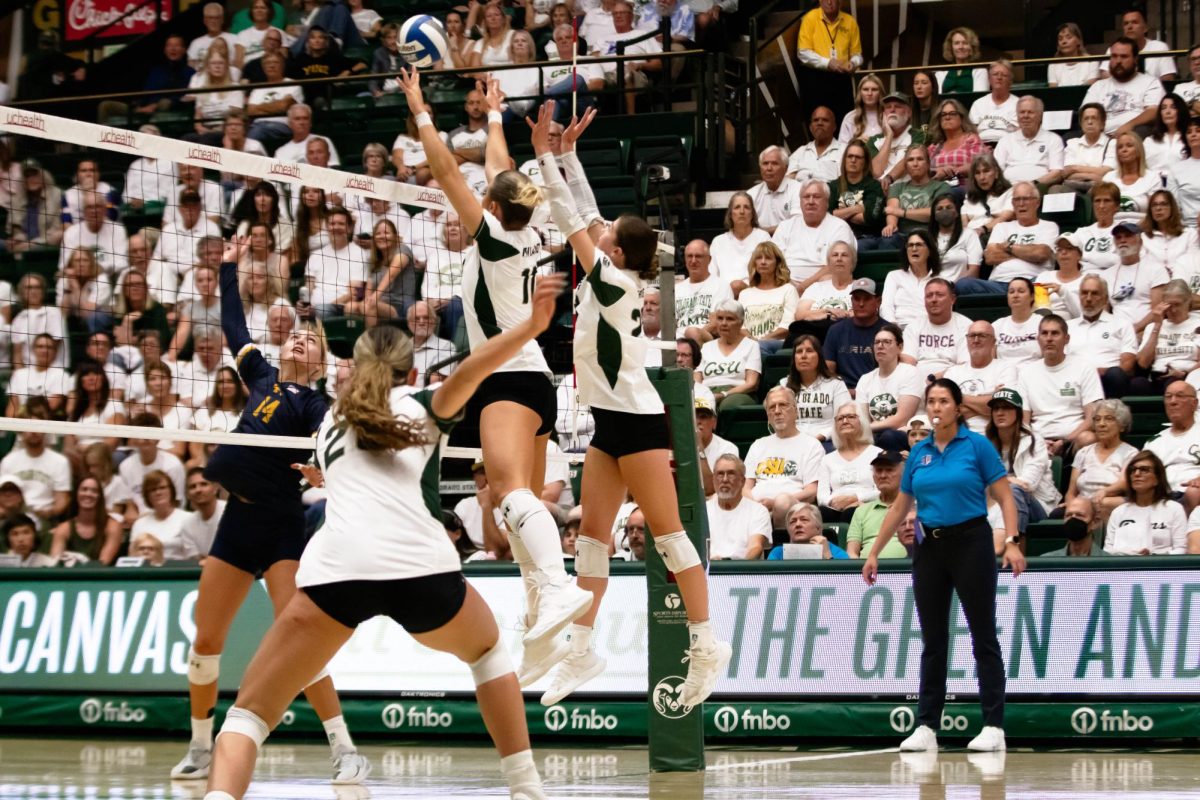 Colorado State University volleyball players jump for the ball during game against Notre Dame at Moby Arena in Fort Collins Colorado, on Friday Sept. 12th. Photo taken by Erica Pickering.