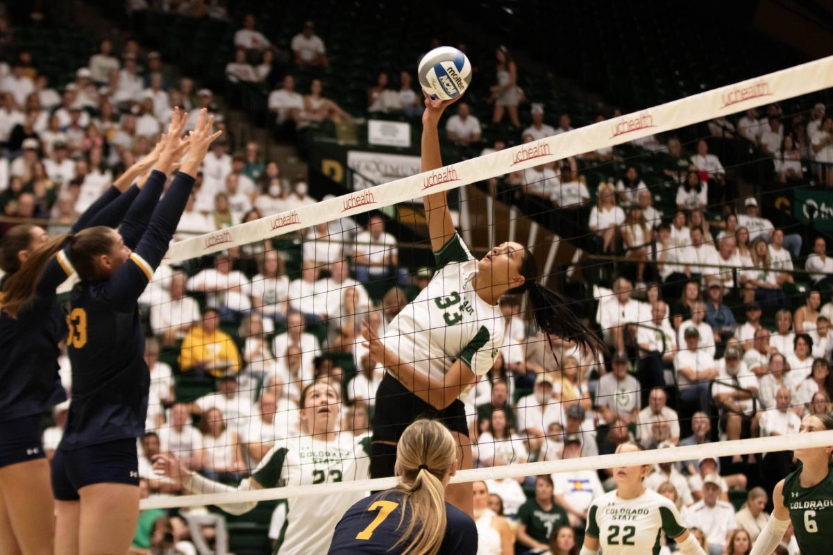 Kekua Richards, middle blocker for Colorado State University blocks the ball against Notre Dame Sept. 12. CSU lost 0-3.