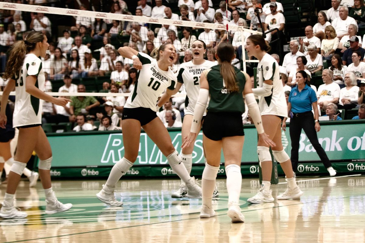 Brenna Rowland celebrates a winning play with her teammates in game against Notre Dame in Moby Arena in Fort Collins, Colorado on Friday Sept. 12th. Photo taken by Erica Pickering.