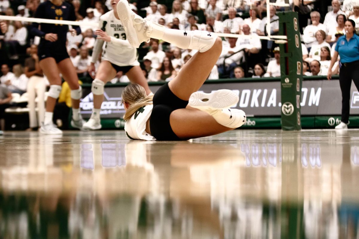 Halle Jameson, outside hitter for Colorado State University, dives for the ball during game against Notre Dame in Moby Arena in Fort Collins Colorado on Friday Sept. 12th. Photo taken by Erica Pickering.