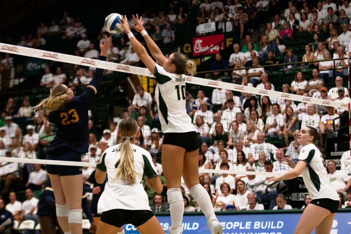 Colorado State University middle blocker blocks the ball during game against Notre Dame in Moby Arena in Fort Collins Colorado, on Friday Sept. 12th. Photo taken by Erica Pickering.