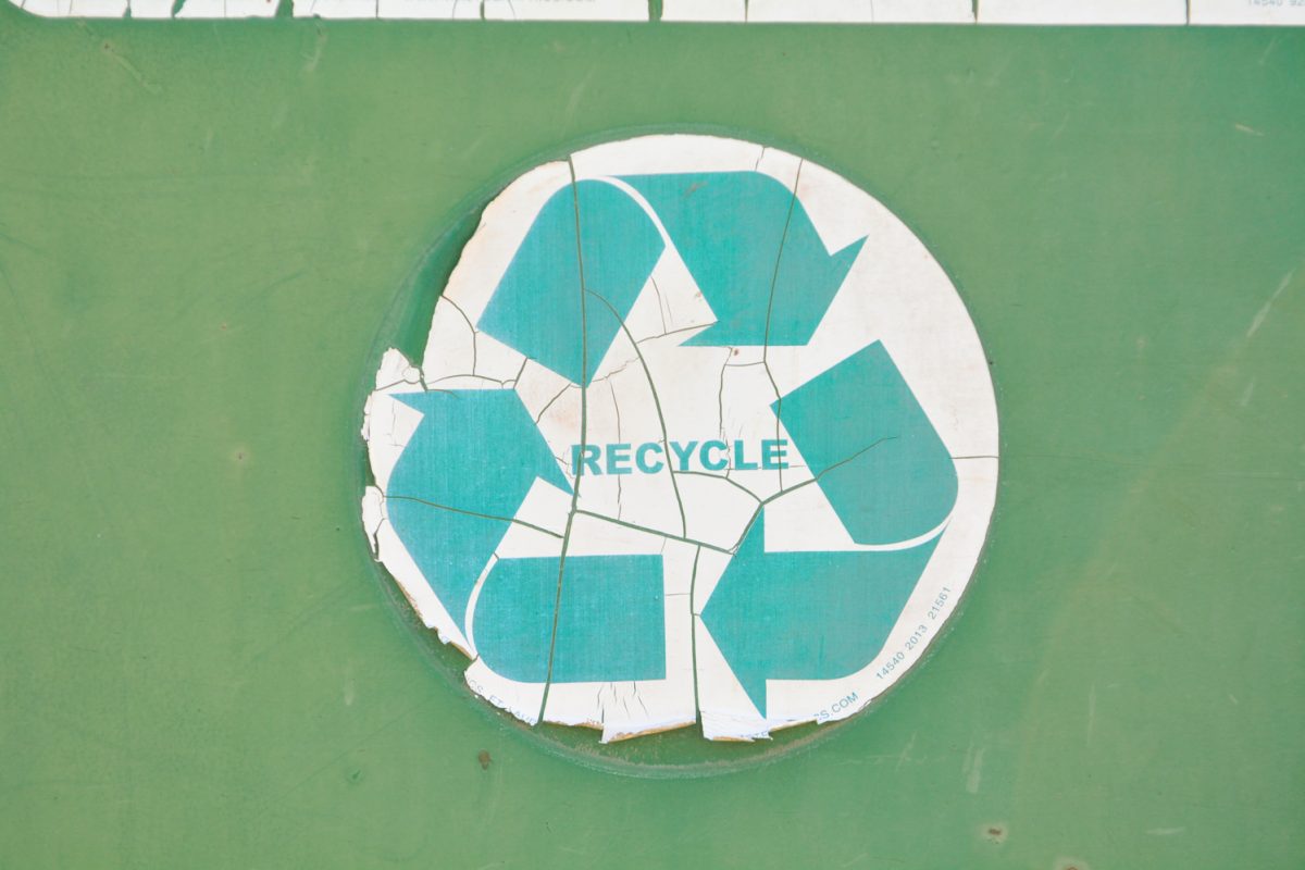 A faded recycling sticker
