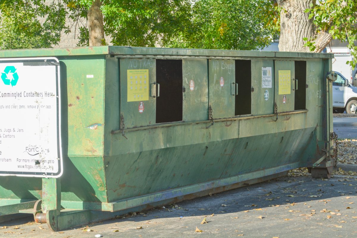 A green recycling container.