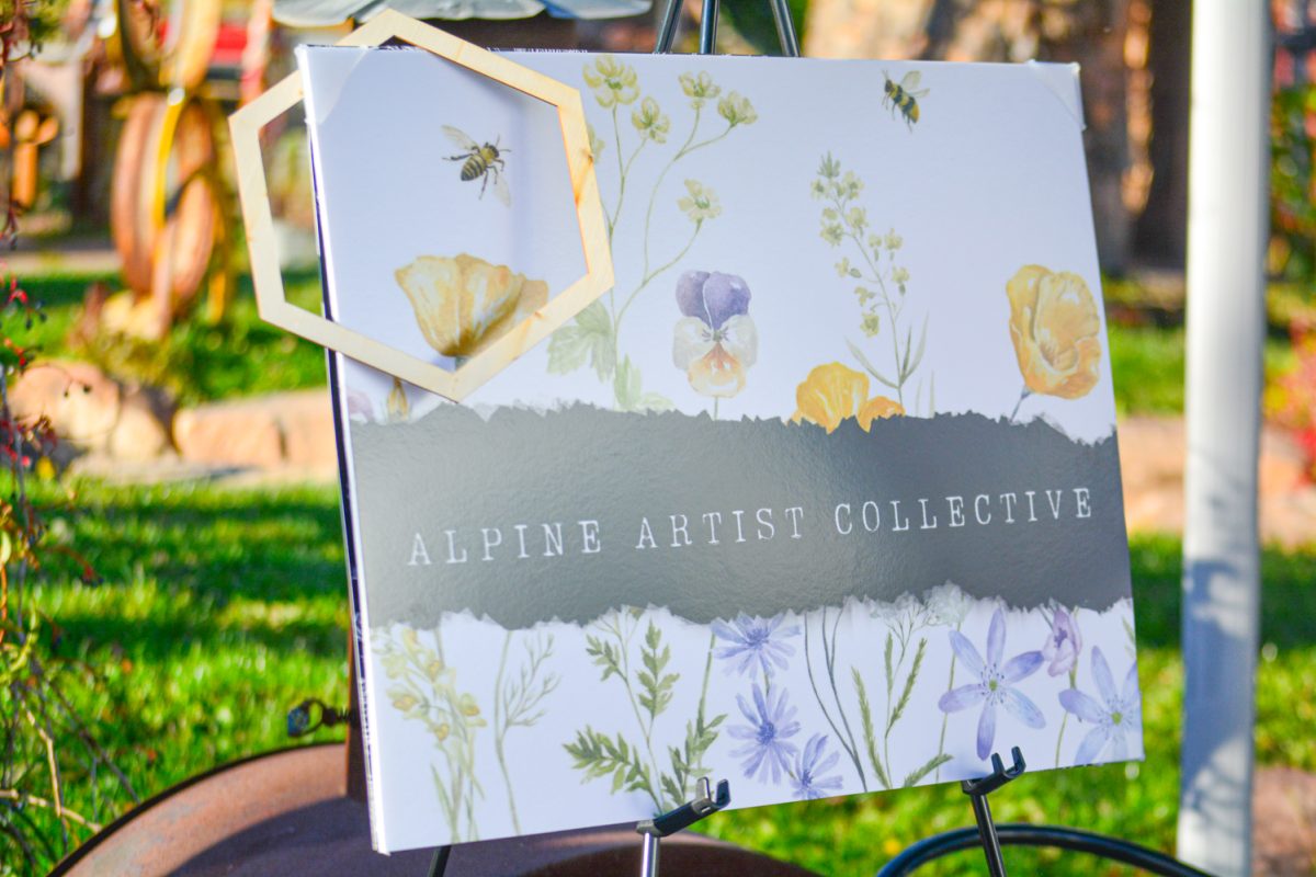 The Alpine Artist Collective sign welcoming guests to enjoy the festival Oct. 19. This festival contained many different events including art, dance, live music and a film festival focusing on artists and nature.