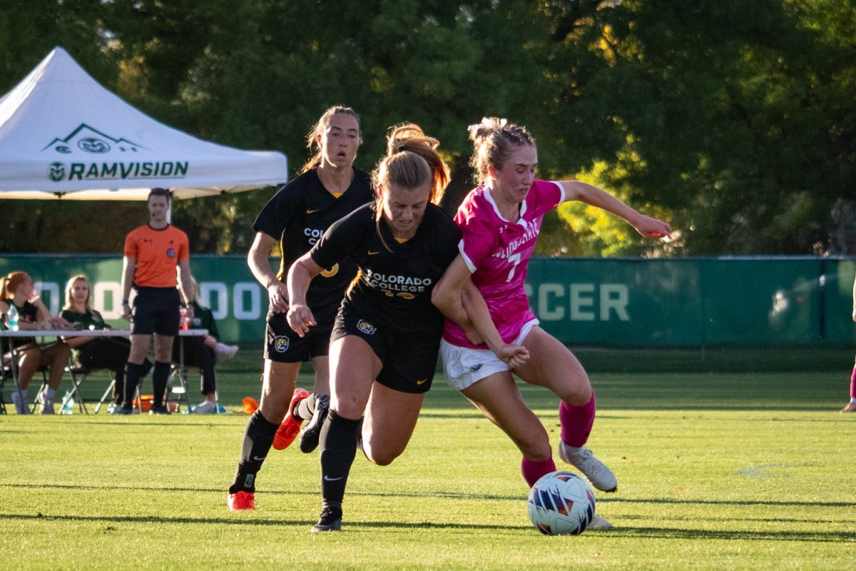 Michaela McGowan (7) fights with a Colorado College player for the ball during the match Oct 9. The Rams went on to beat the Tigers 2-1.