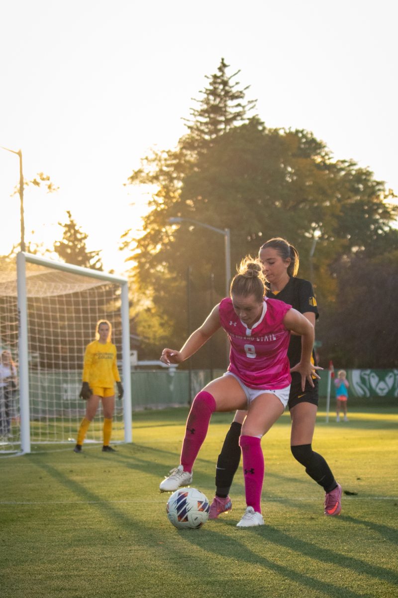 Kacie Laurie (8) tries to keep control of the ball during the match against Colorado College Oct 9. The Rams went on to beat the Tigers 2-1.