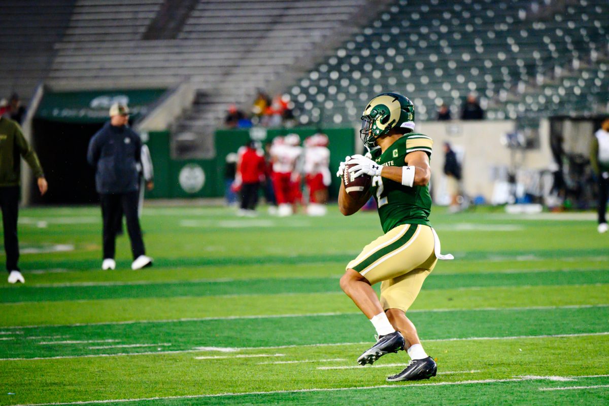 Colorado State University running back Jalen Dupree (2) catches a throw from a coach during team warmups before CSU's game against Fresno State University Oct. 10.