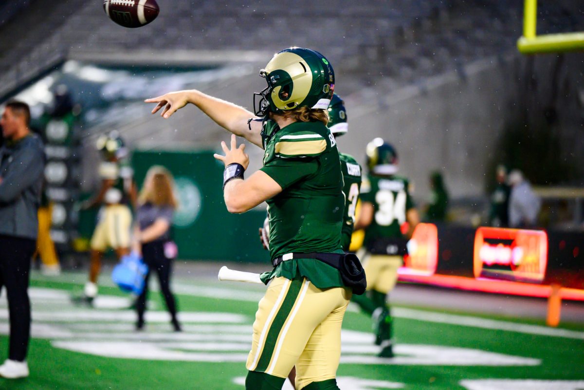 Colorado State University quarterback Jackson Brousseau (7) throws a ball to a teammate during warmups before CSU's game against Fresno State University Oct. 10.