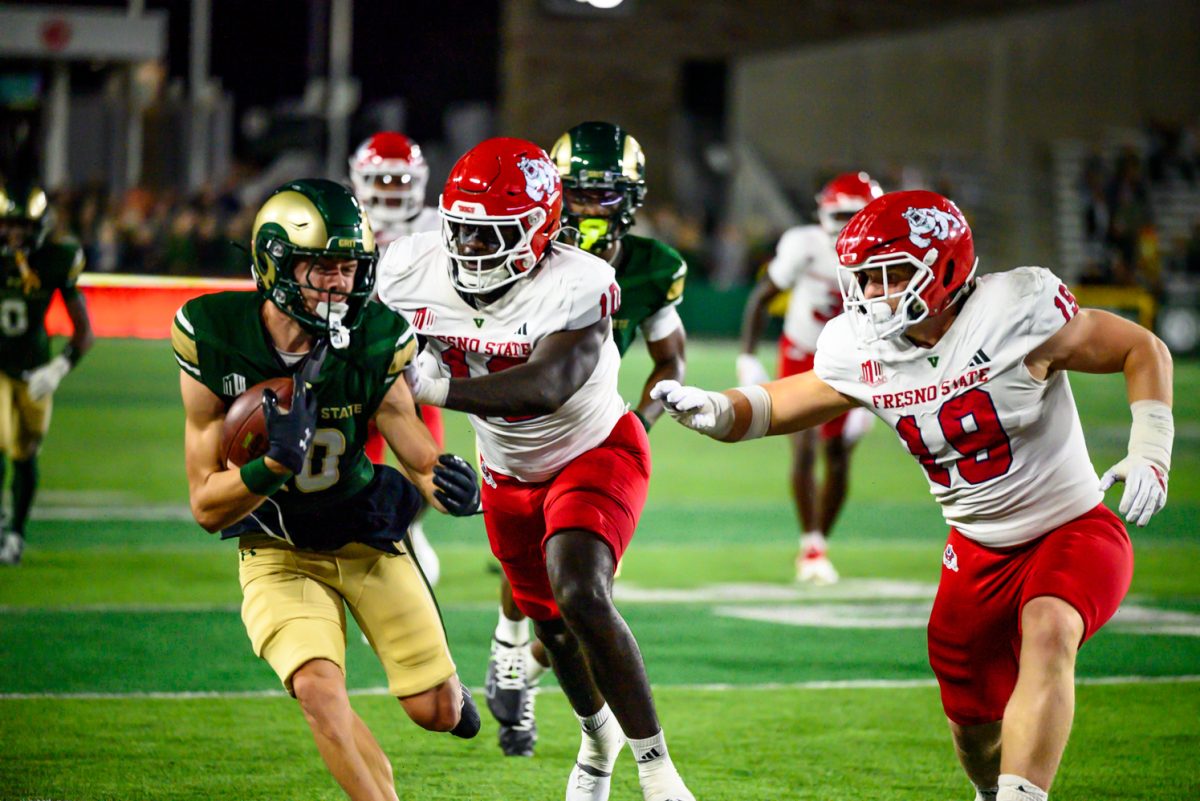 Colorado State University wide receiver Tommy Maher (10) struggles against Fresno State University's defense while making a run down the sideline during CSU's game against FSU Oct. 10. CSU won 49-21.