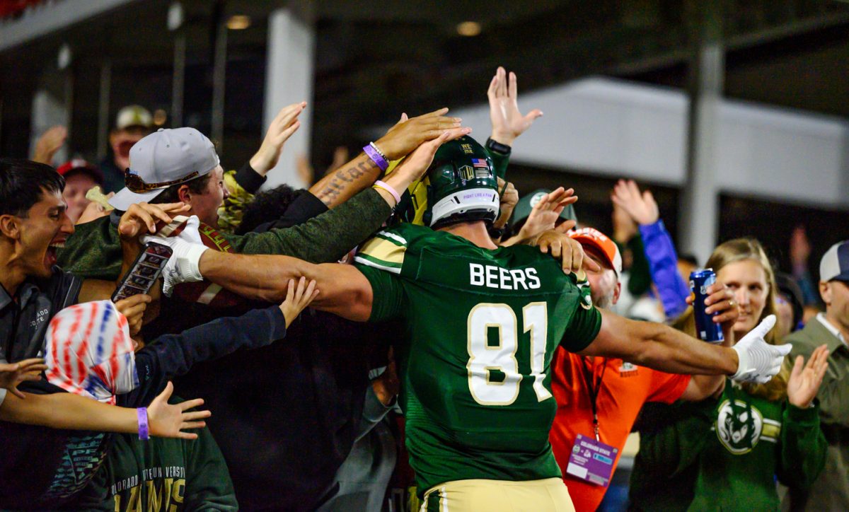Colorado State University fans embrace tight end Rocky Beers (81) after a touchdown during CSU's game against Fresno State University Oct. 10.