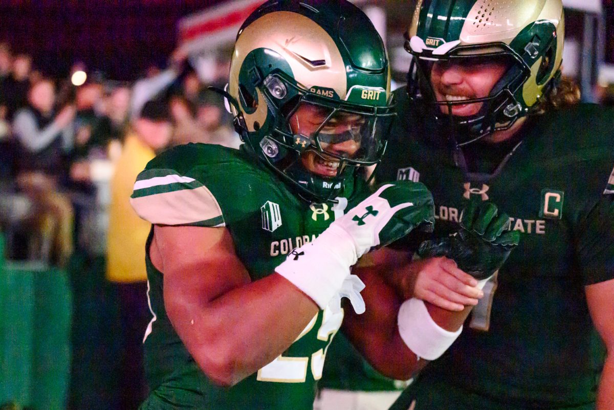 Colorado State University running back Lloyd Avant (25) celebrates a touchdown with quarterback Jackson Brousseau (7) during CSU's game against Fresno State University Oct. 10.