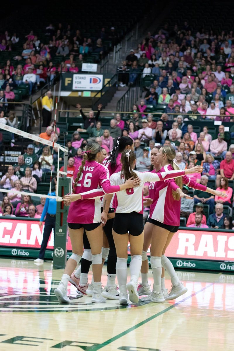 Colorado State University's volleyball team celebrates a point against Utah State University Oct. 11.
