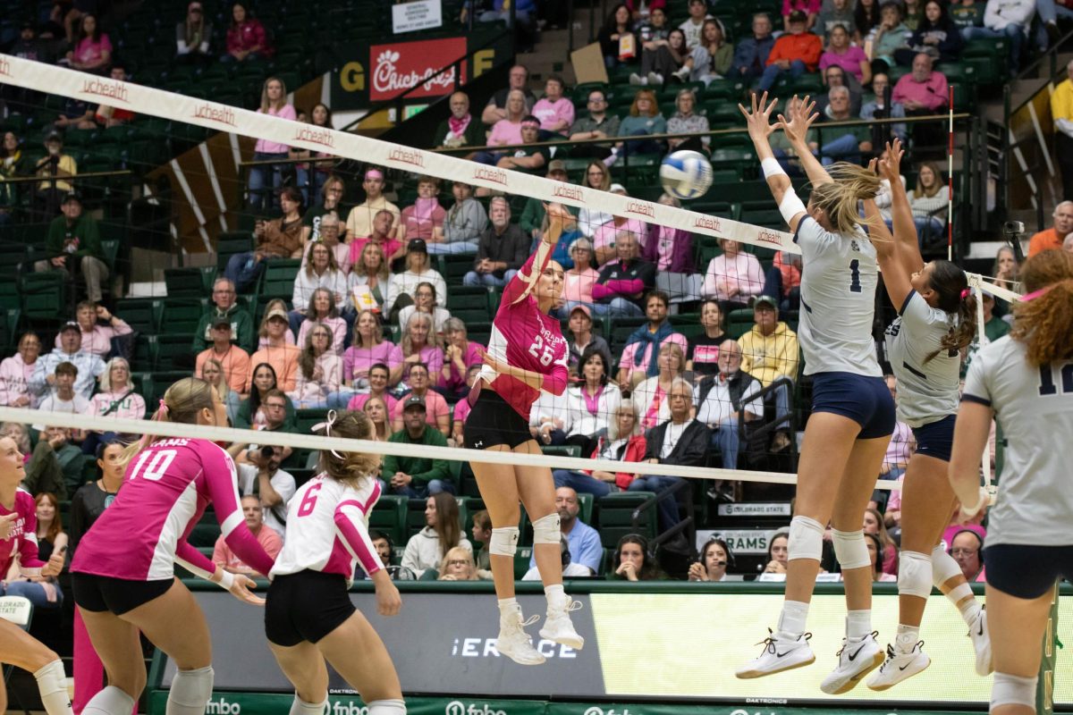 Maria Brun (26) hits the ball over the net during Colorado State University's pink out game against Utah State University Oct 11.