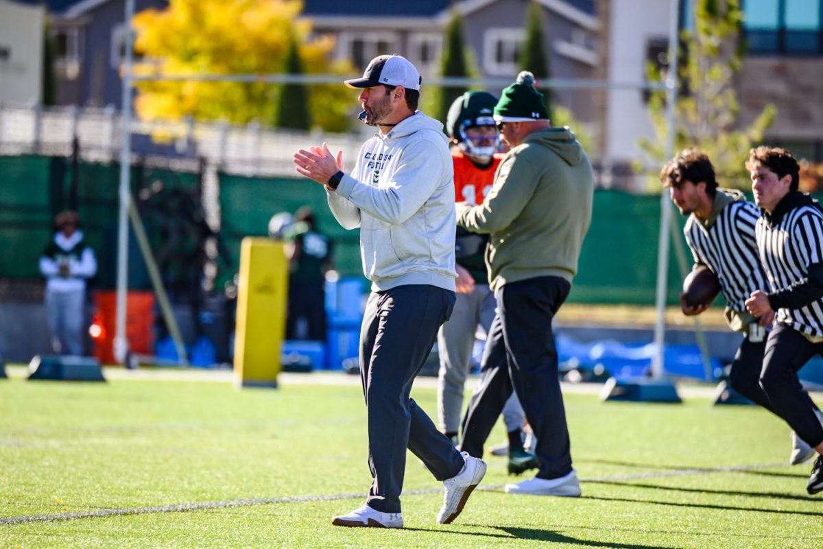 Colorado State University football interim head coach Tyson Summers blows a whistle to call a drill during football practice Oct. 21. Summers was named as interim head coach on Sunday, Oct. 19 after former head coach Jay Norvell was let go. 