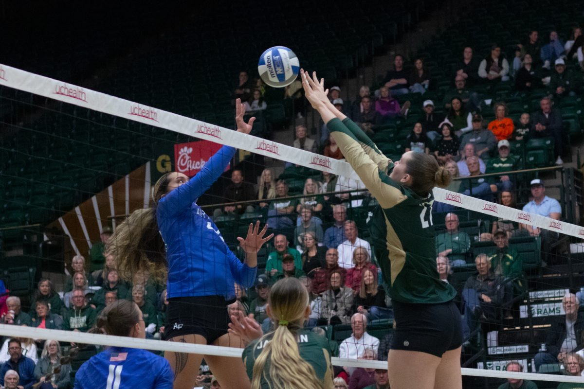 Eve Wilson (27) attempts to block a tip  during the match versus Air Force Oct 23. The Rams beat the Falcons 3-1.