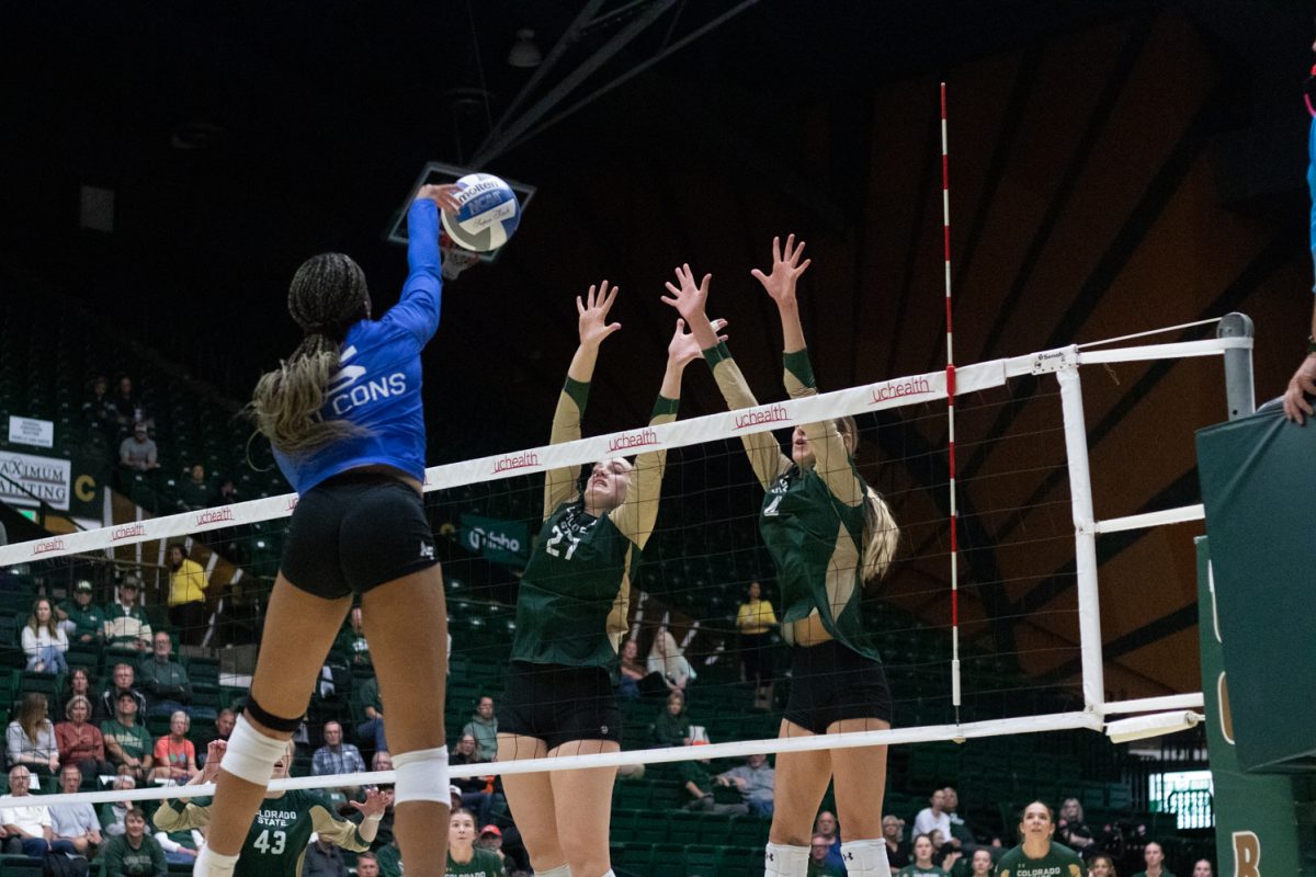 Eve Wilson (27) and Halle Jameson (4) attempt to block the ball  during the match versus Air Force Oct 23. The Rams beat the Falcons 3-1.