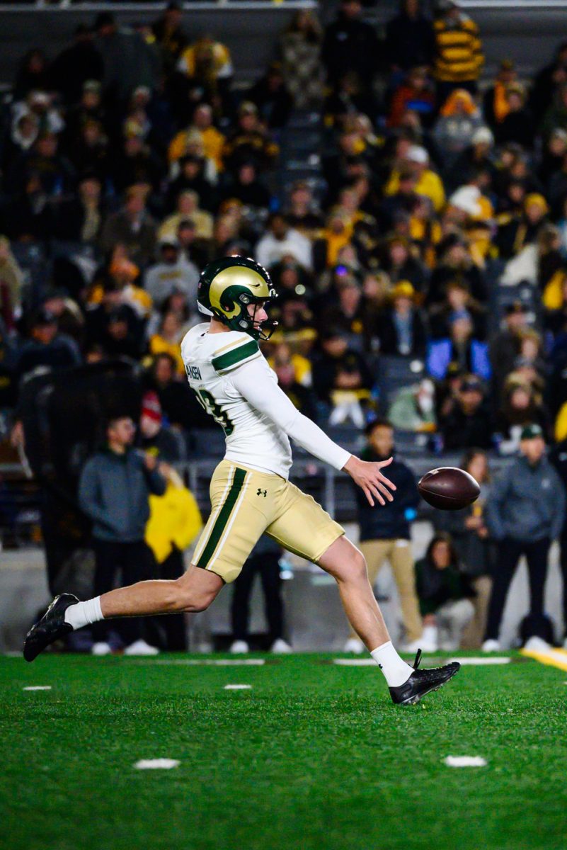 Colorado State University football kicker Bryan Hansen (83) punts the ball across the field during CSU's game against the University of Wyoming Oct. 25.