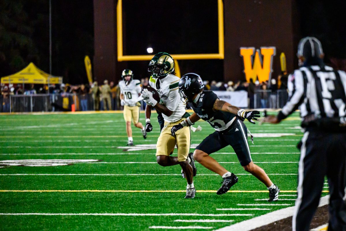 Colorado State University football wide receiver Tay Lanier (6) makes a run down the sideline while being pressured by a University of Wyoming defender Oct. 25.