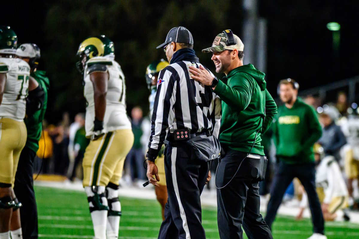 Colorado State University football interim head coach Tyson Summers talks to a referee during CSU's game against the University of Wyoming Oct. 25.