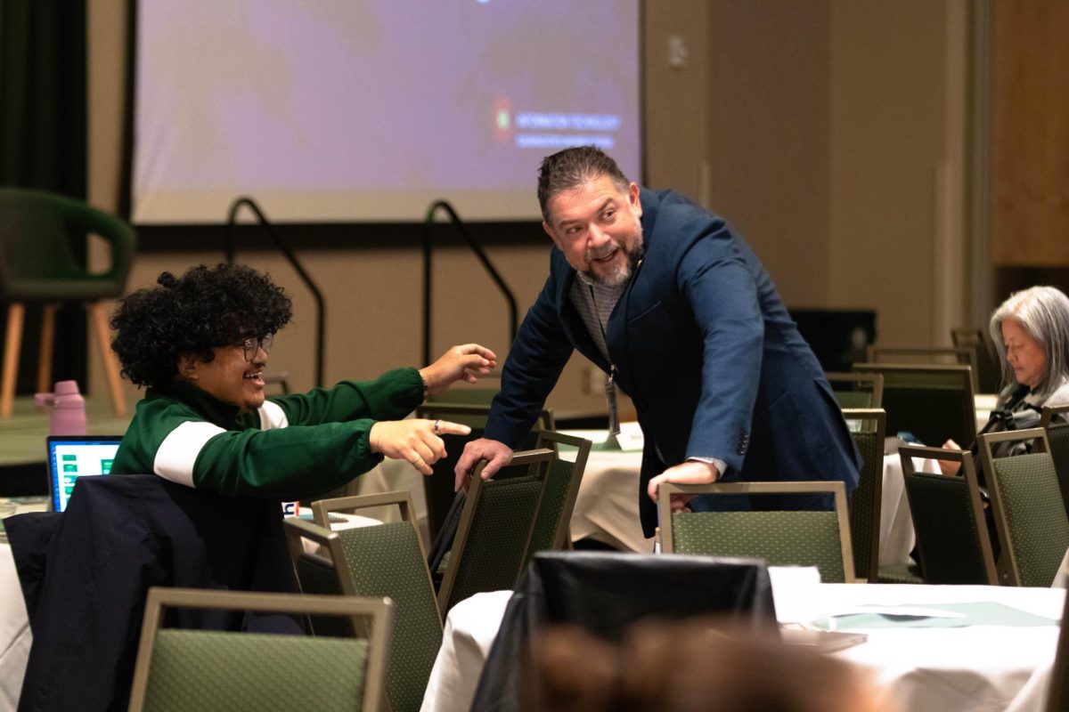 Atendees laugh during the the CSU Ignites AI: Shaping Tomorrow Together event at Colorado State University Fort Collins Colorado Oct. 14.