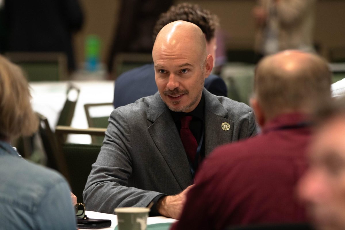 Atendees conversing before the start of the CSU Ignites AI: Shaping Tomorrow Together event at Colorado State University Fort Collins Colorado Oct. 14.