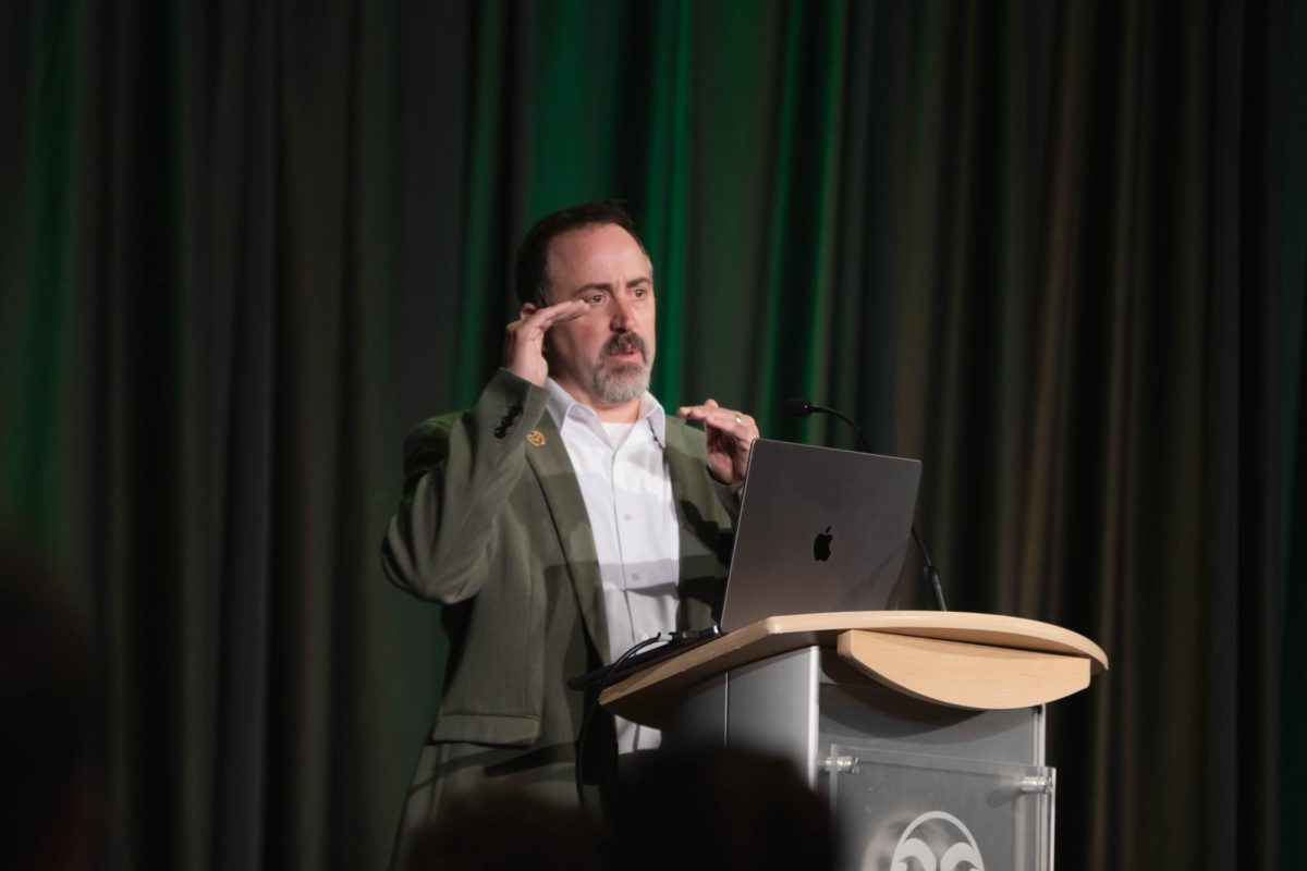 Speaker Brandon Bernier introduces the start of the AI Symposium, CSU Ignites AI: Shaping tomorrow together at Colorado State University Fort Collins Colorado Oct. 14. "The whole idea for today is to be able to be challenged on new ideas, to be able to find new ways to look at things," said Bernier.