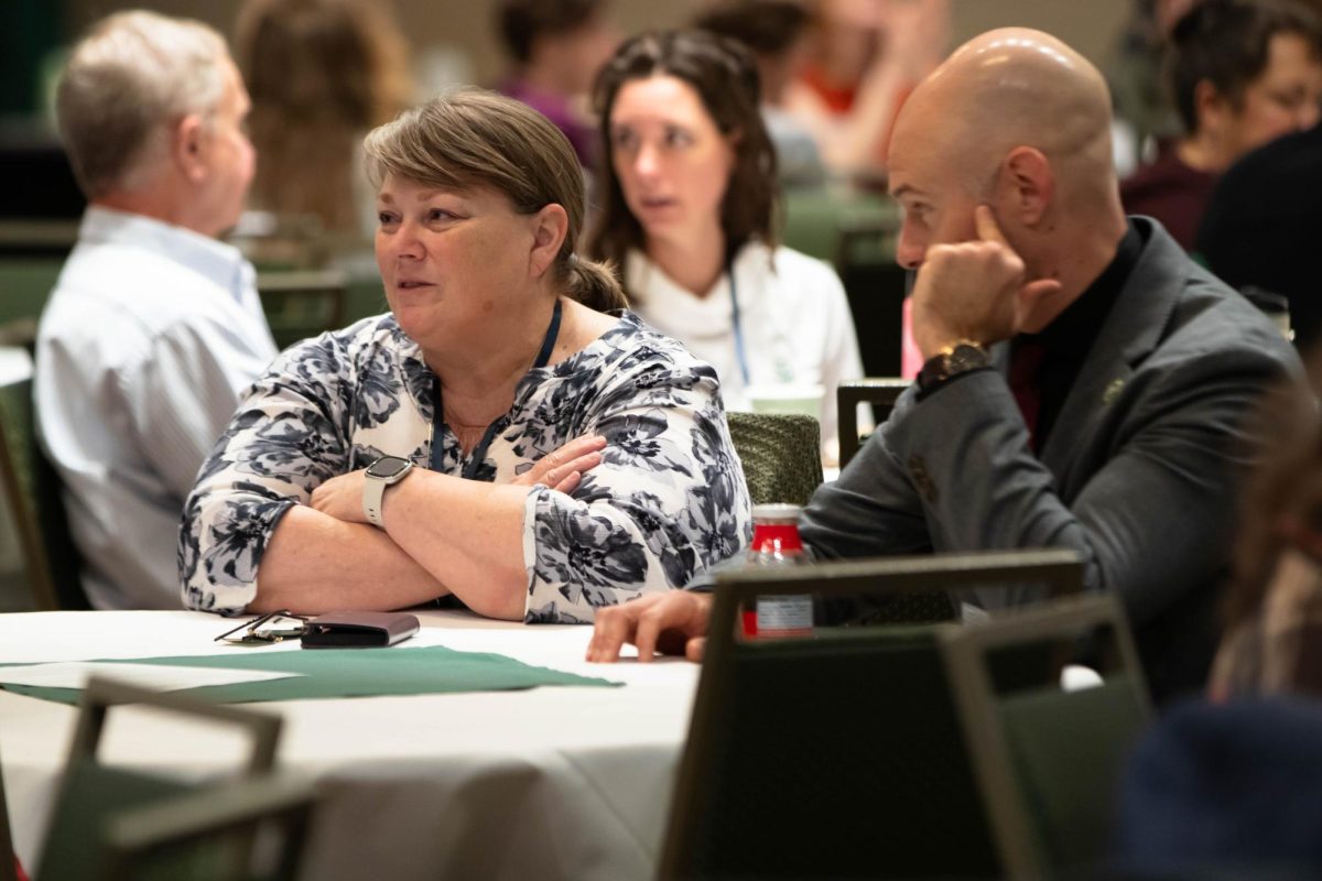 Atendees engagaging before the start of the CSU Ignites AI: Shaping Tomorrow Together event at Colorado State University Fort Collins Colorado Oct. 14.