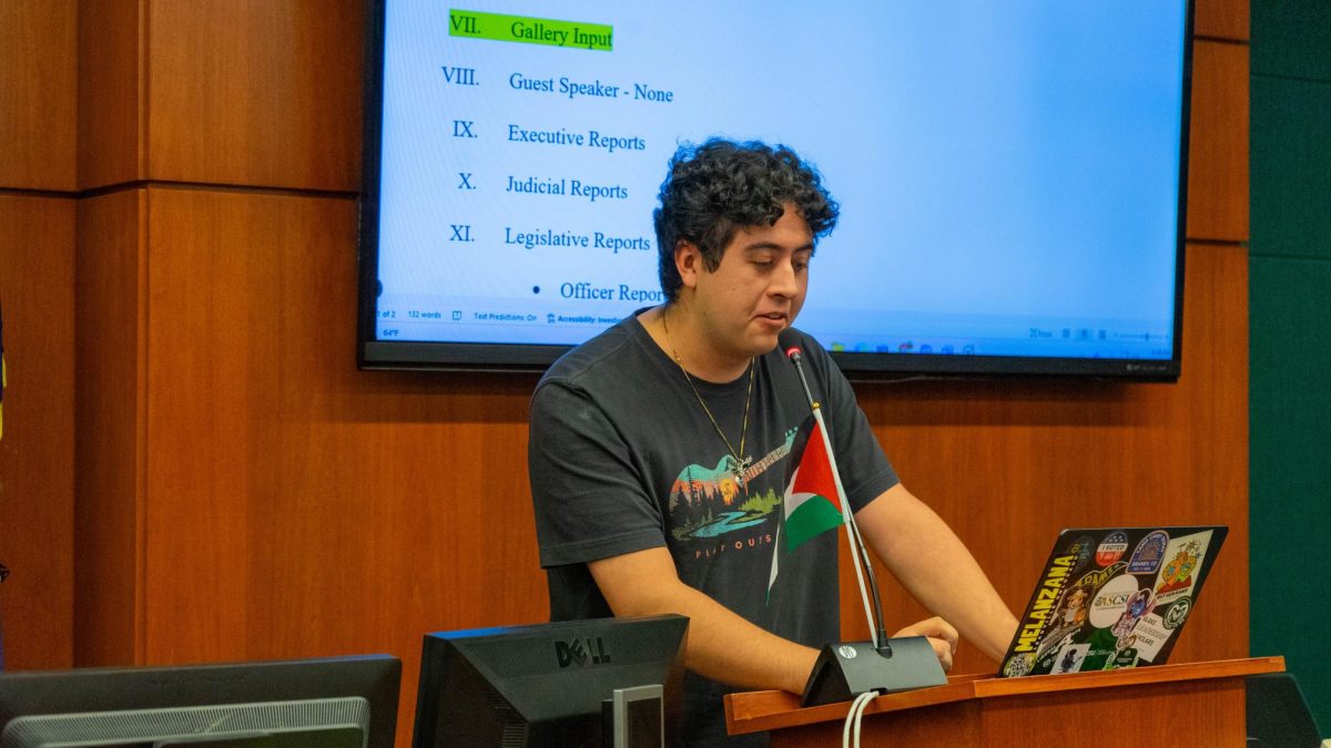 ASCSU Director of Unified Success Ben Gregg speaks during Gallery Input at the Oct. 8 ASCSU Senate Session. "I've always thought that to ignore the cries of the oppressed is to become a voice for the oppressor," said Gregg. "I've seen what it looks like firsthand when good people don't stand up for what they believe in. I've seen comfort and convenience outweigh courage. I've seen the walls go up and voices shut down. So I say this now to anyone who thinks their silence protects them, to anyone who believes doing nothing is harmless, your silence is a weapon, and your inaction has consequences."