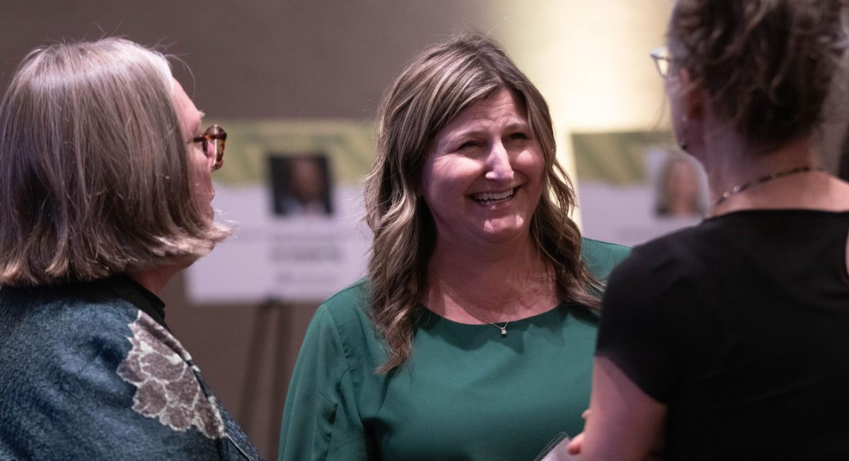 CSU employee Kim Winger laughs with peers at the Alumni Awards event at Colorado State University in Fort Collins Colorado, Oct. 16. "It's such a special place." Said Winger.