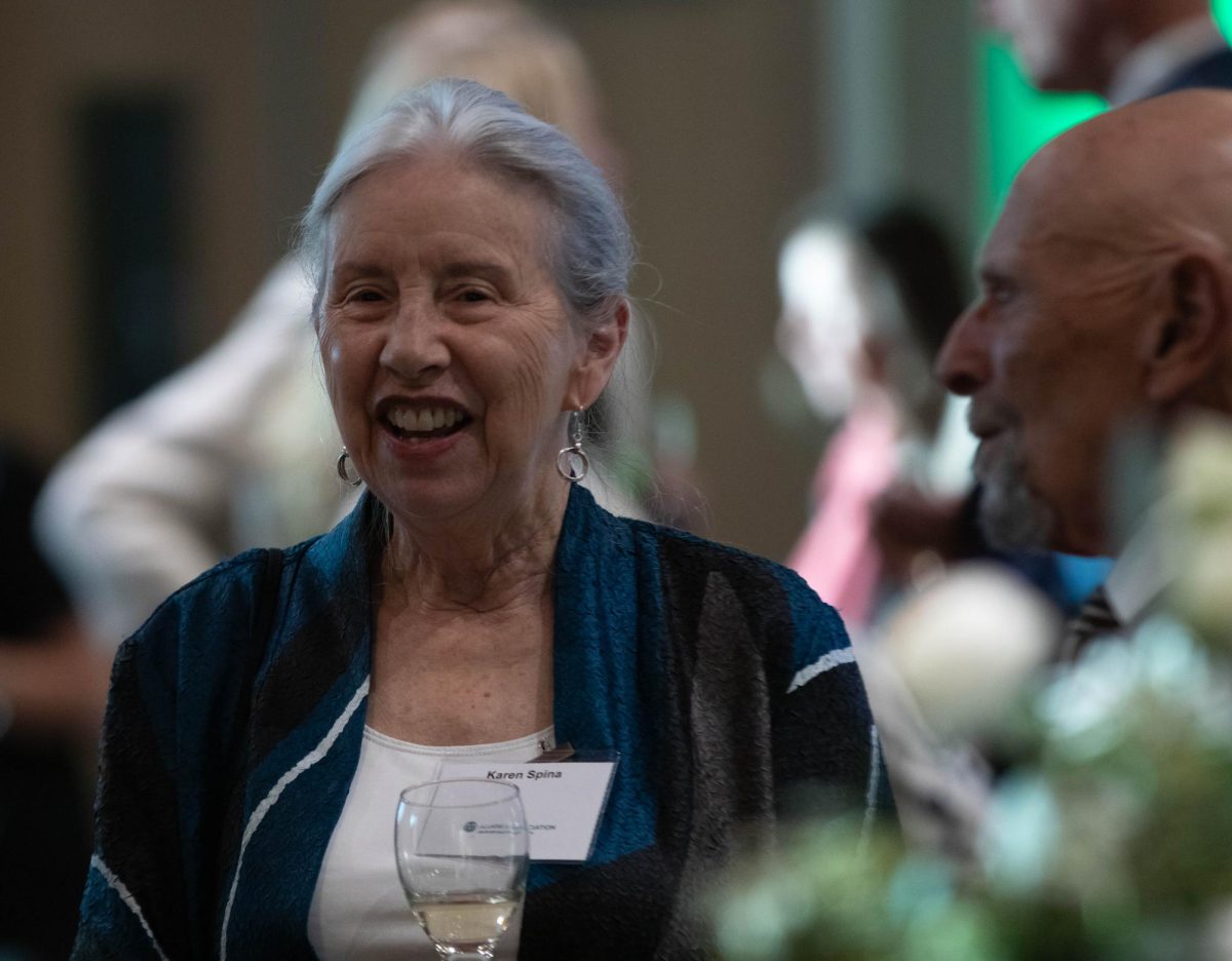 Karen Spina laughs with other alumnists at the Alumni Awards event at Colorado State University in Fort Collins Colorado, Oct. 16.