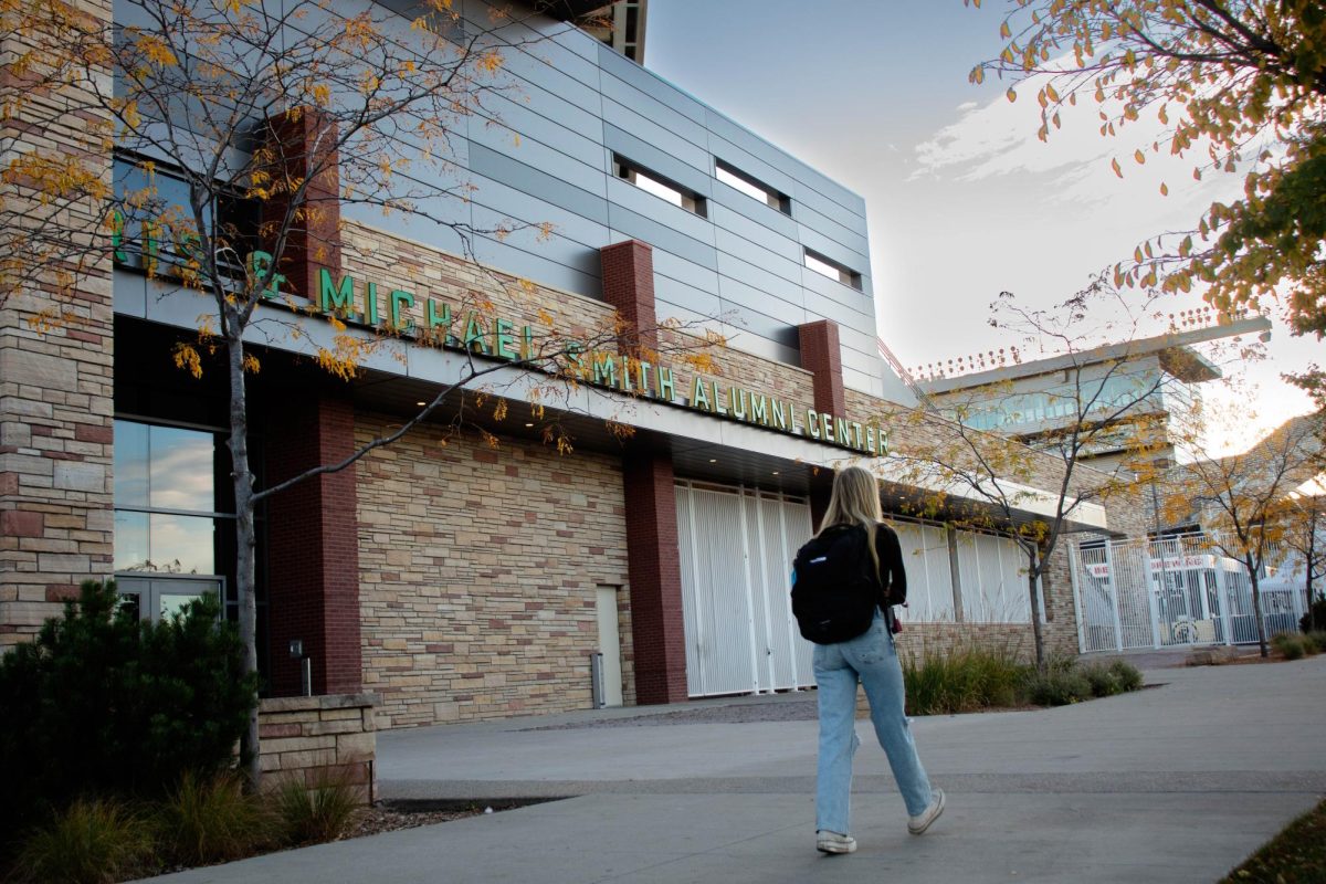 Student passes by the Iris & Micheal Smith Alumni Center at Colorado State University in Fort Collins Colorado Oct. 13.