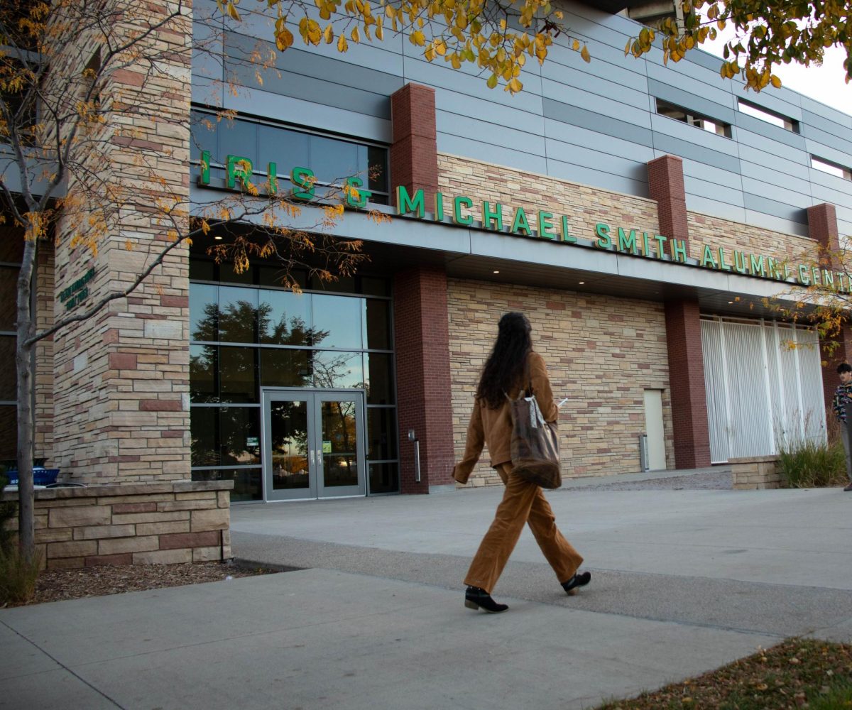 A student passes by the Iris & Michael Smith Alumni Center at Colorado State University Oct. 13.