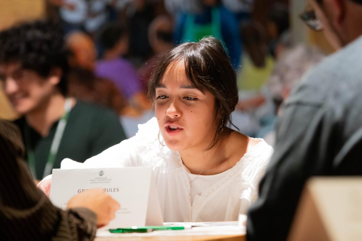 Participant engages with others at the Ballot Forum in at Avogadro's Number Bar, Fort Collins Colorado, Oct. 15.