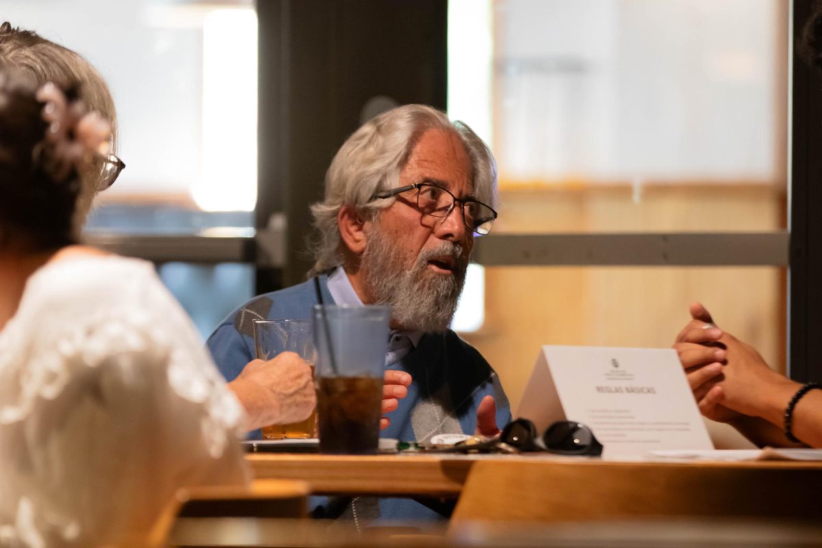 People engage with each other at Ballot forum at Avogadro's Number Bar in Fort Collins Colorado, Oct. 15.