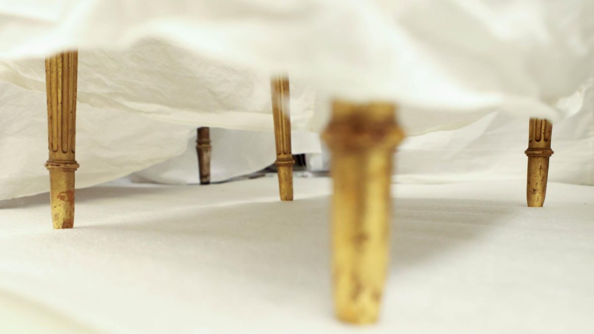 Decades of chairs are covered by linen fabrics in the Avenir Museums' archived collection, showcasing the correlation in furniture design and architecture with clothing design throughout the decades, Oct. 5. 